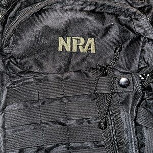NRA tactical bag with multiple pockets and loops for carribeaners